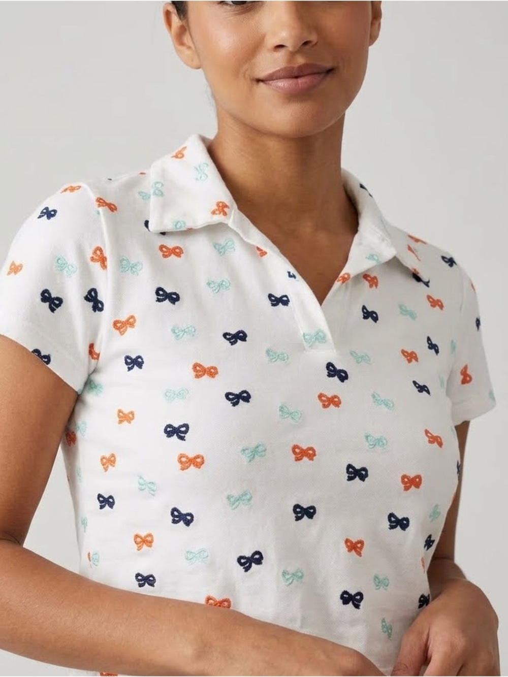 Anthropologie Maeve White Cropped Polo Top with Navy, Orange & Mint Bow Print